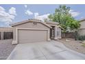 Charming single-story home featuring a two-car garage, desert landscaping, and a welcoming front entrance at 2579 E Camellia Dr, Gilbert, AZ 85296
