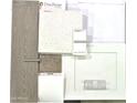 Display showcasing neutral interior design samples including flooring, countertops, backsplash and cabinet samples at 312 W Flax Dr, San Tan Valley, AZ 85140