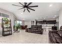 Open concept living space with a seamless flow between the kitchen, dining, and living areas at 3264 E Luna Dr, San Tan Valley, AZ 85143