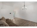 Open living space with combined tile and wood-look floors at 3646 N 67Th Ave # 20, Phoenix, AZ 85033