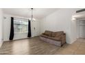 Inviting living room with a large window and neutral decor at 3646 N 67Th Ave # 20, Phoenix, AZ 85033