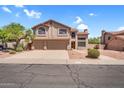 Charming two-story home featuring a three-car garage, desert landscaping, and a cozy residential neighborhood at 3926 E Lavender Ln, Phoenix, AZ 85044
