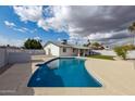 Inviting pool with a clean, modern design in a spacious backyard setting at 405 E Cornell Dr, Tempe, AZ 85283