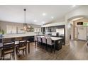 Bright, modern kitchen with an island, stainless steel appliances and pendant lighting at 420 S Dodge Dr, Chandler, AZ 85225