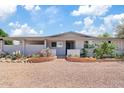 Inviting front entrance with desert landscaping and a charming brick pathway at 4613 E Shangri La Rd --, Phoenix, AZ 85028