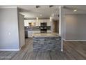 Updated kitchen featuring white cabinets, granite countertops, stainless steel appliances, and a stylish tile backsplash at 5815 N 21St Ave, Phoenix, AZ 85015