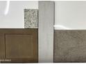 Close-up of various flooring and cabinet material samples for the home's interior finishes at 820 W Riparian Dr, San Tan Valley, AZ 85140