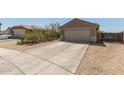Single-Gathering home featuring a two-car garage, desert landscaping, and a concrete driveway at 829 S 111Th Dr, Avondale, AZ 85323