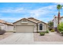 Charming single-story home featuring a two-car garage and desert landscaping at 8948 W Fargo Dr, Peoria, AZ 85382