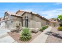 Charming single-story home featuring a two-car garage and desert landscaping at 8948 W Fargo Dr, Peoria, AZ 85382