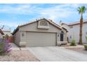 Charming single-story home featuring a two-car garage and desert landscaping at 8948 W Fargo Dr, Peoria, AZ 85382