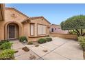 Charming home with manicured landscaping, providing excellent curb appeal at 17009 W Eureka Springs Dr, Surprise, AZ 85387