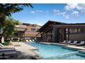 Relaxing community pool area with comfortable lounge seating and modern architecture at 19360 N 73Rd St # 1066, Scottsdale, AZ 85255