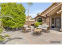 Relaxing outdoor patio with comfortable seating and mature landscaping at 1962 E Morrow Dr, Phoenix, AZ 85024