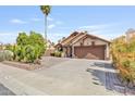 Lovely one-story home with well-maintained landscaping, neutral paint, and a two-car garage at 1962 E Morrow Dr, Phoenix, AZ 85024