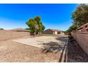 Full-size basketball court in the backyard providing ample space for recreation and sports activities at 19903 S 187Th Dr, Queen Creek, AZ 85142