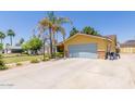 Spacious home featuring a large driveway and convenient attached two car garage at 3554 W Aire Libre Ave, Phoenix, AZ 85053
