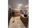 Well-equipped kitchen with stainless steel appliances and ample cabinet space at 40724 W Novak Ln, Maricopa, AZ 85138