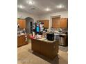 Spacious kitchen featuring an island and stainless steel appliances at 40724 W Novak Ln, Maricopa, AZ 85138