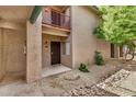 Welcoming condo entrance with decorative stone, mature trees, and easy access to amenities at 4354 N 82Nd St # 178, Scottsdale, AZ 85251