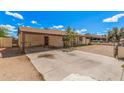 Expansive concrete backyard featuring a covered patio, perfect for outdoor entertaining and relaxation at 5529 W Virginia Ave, Phoenix, AZ 85035