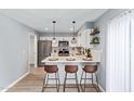 Beautiful kitchen with stainless steel appliances, breakfast bar, and modern pendant lighting at 6565 N 19Th Ave # 45, Phoenix, AZ 85015