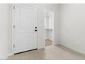 Bright entryway featuring a closet and a white door, with tile flooring and neutral walls at 7430 S 75Th Dr, Laveen, AZ 85339