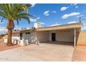 This home features a charming single story with a covered carport and desert landscaping at 8033 N 56Th Ave, Glendale, AZ 85302