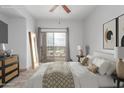 Relaxing main bedroom with an open balcony, soft carpet and light-blocking curtains for a comfortable atmosphere at 9820 N Central Ave # 224, Phoenix, AZ 85020