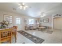 Comfortable living area adjacent to dining space, perfect for Gathering gatherings at 11012 E Knowles Ave, Mesa, AZ 85209
