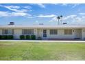 Charming one-story condo with well-maintained lawn and desert landscaping at 13632 N Silverbell Dr, Sun City, AZ 85351