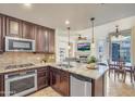 Modern kitchen with stainless steel appliances and granite countertops at 140 E Rio Salado Pkwy # 402, Tempe, AZ 85281