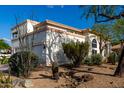 Rear of a two-story home featuring a balcony and desert landscaping at 1625 E Monte Cristo Ave, Phoenix, AZ 85022