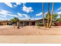 Attractive single-story home with a well-maintained yard and welcoming entrance at 1650 E Gary St, Mesa, AZ 85203
