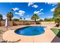 Refreshing backyard pool with lush landscaping, perfect for relaxing and entertaining at 1650 E Gary St, Mesa, AZ 85203