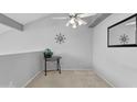 Bright bedroom featuring neutral paint, carpeted floors, a ceiling fan, and a decorative mirror at 2201 N Comanche Dr # 1094, Chandler, AZ 85224