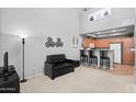 Inviting living room with modern decor, open to the kitchen with bar seating at 2201 N Comanche Dr # 1094, Chandler, AZ 85224