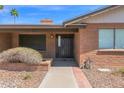 Charming front entrance with brick accents and desert-style landscaping at 2524 E Elmwood St, Mesa, AZ 85213
