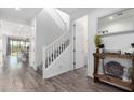 Bright and airy foyer featuring modern flooring, staircase, and stylish decor at 26116 N Thornhill Dr, Peoria, AZ 85383