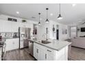 Modern kitchen with stainless steel appliances, a large island, and granite countertops at 26116 N Thornhill Dr, Peoria, AZ 85383