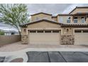 Attached two car garage with attractive stone accents and desert landscaping at 2821 S Skyline Dr # 149, Mesa, AZ 85212
