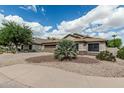 Charming single-story home with a well-manicured front yard and a two-car garage, creating great curb appeal at 29915 N Maravilla Dr, San Tan Valley, AZ 85143