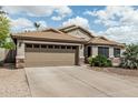 Charming single-story home featuring a desert landscaped yard and a convenient two-car garage at 29915 N Maravilla Dr, San Tan Valley, AZ 85143