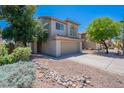 Charming two-story home with a well-manicured front yard and inviting curb appeal at 3233 E Sequoia Dr, Phoenix, AZ 85050