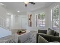 Bright living room featuring a neutral color palette, large windows, and comfortable seating at 3233 E Sequoia Dr, Phoenix, AZ 85050