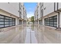 Modern townhome exterior featuring glass garage doors and neutral color palette at 325 E Coronado Rd # 8, Phoenix, AZ 85004
