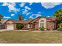 Charming single-story home with a well-manicured lawn and inviting curb appeal at 3756 E Clovis Ave, Mesa, AZ 85206