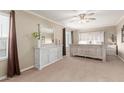 Serene main bedroom with neutral tones, a spacious layout, and elegant furnishings at 4106 E Muirwood Dr, Phoenix, AZ 85048