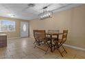 Inviting dining room with a rustic table set and a stylish chandelier at 5519 W Campbell Ave, Phoenix, AZ 85031