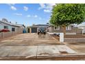Charming home showcasing a spacious driveway and a well-maintained yard at 5519 W Campbell Ave, Phoenix, AZ 85031